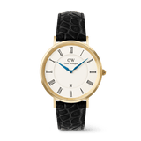 Daniel Wellington Classic Roman Numerals Date Black Croc Bellyの正面画像です。ゴールドケースにマットホワイトのローマ数字文字盤、ブルースチールの針、6時位置の日付表示窓、ブラッククロコベリーレザーストラップをあしらった40mmサイズの腕時計です。