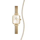 Daniel WellingtonのQuadro Miniは、シャンパンダイヤルとゴールドのEvergoldメッシュストラップを組み合わせたスクエアケースの腕時計と、クリスタルが一列に輝くClassic Tennis Necklaceのゴールドトーンギフトセットです。