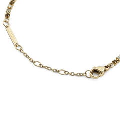 Classic Tennis Bracelet Honey Combo Goldのクラスプ周りのディテールです。Daniel Wellingtonの刻印が入ったゴールドのブランドプレート、サイズ調整用のチェーン、ロブスタークラスプが確認できます。