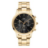 Daniel Wellington Iconic Chronograph Link Onyx Gの正面画像。ブラックのサンレイ仕上げ文字盤にゴールドのインデックスと針、3つのサブダイヤルを配したクロノグラフモデルです。サテンとポリッシュのコンビネーション仕上げを施したゴールドのリンクブレスレットが特徴です。