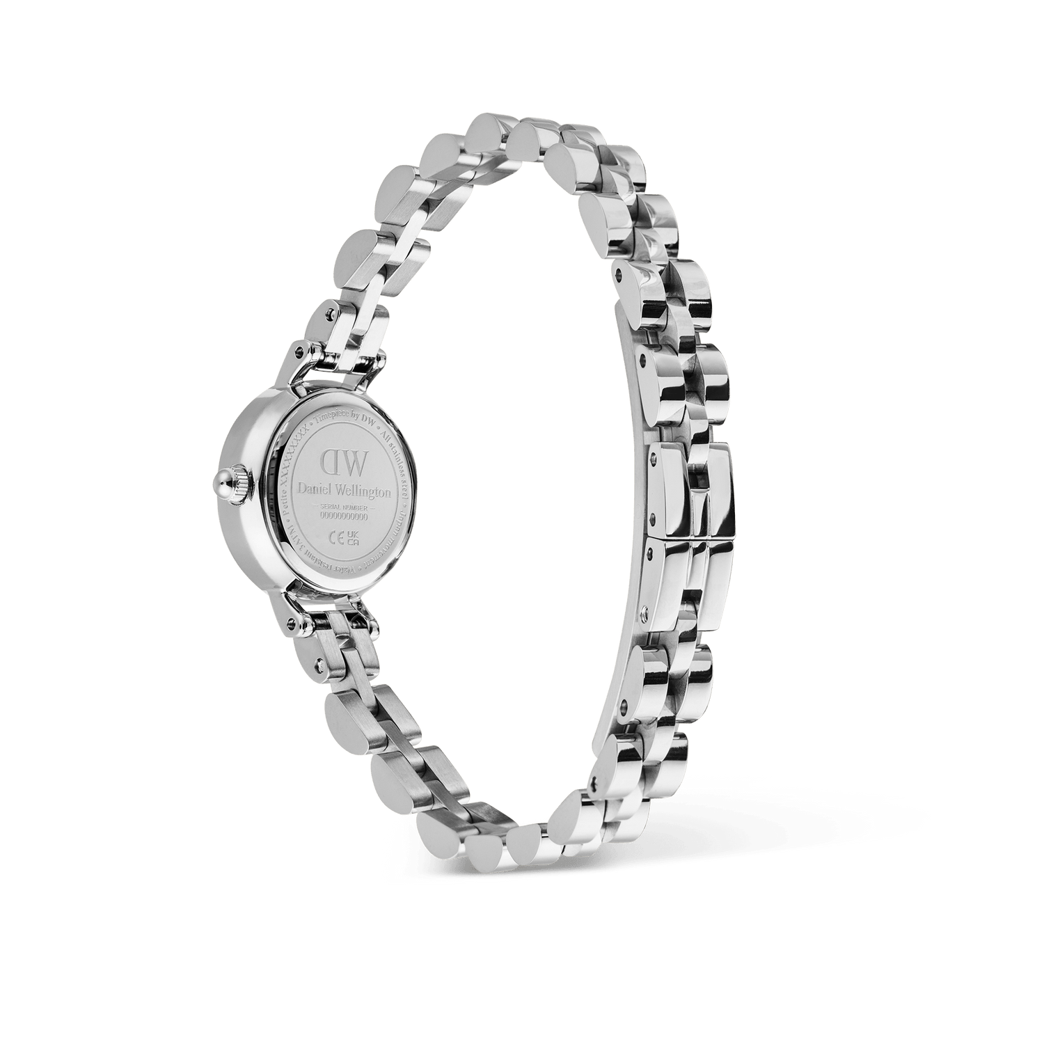 Petite Mini Arch 3-link White Silverの裏蓋側から撮影した画像です。Daniel Wellingtonのロゴが刻印されたケースバックと、バタフライ式の留め具の構造が確認できます。シルバーのアーチ型3リンクブレスレットは円を描くように配され、各リンクの立体感と上質な研磨仕上げが際立っています。