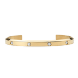 Daniel Wellington Classic Lumine Bracelet Goldの正面からのプロダクトカットです。磨き上げられたゴールドカフにキュービックジルコニアが等間隔に埋め込まれ、フラットな仕上がりながらも控えめな輝きが際立ちます。