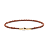 Daniel WellingtonのBraided Leather Bracelet St Mawes 2.8 Goldの全体像。ライトブラウンの編み込みレザーにゴールドのロブスタークラスプが映える、白背景での商品単体写真です。