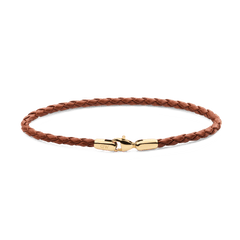 Daniel WellingtonのBraided Leather Bracelet St Mawes 2.8 Goldの全体像。ライトブラウンの編み込みレザーにゴールドのロブスタークラスプが映える、白背景での商品単体写真です。