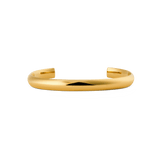 Daniel WellingtonのArch Cuff Gold 6mmは、ポリッシュ仕上げの滑らかなアーチ型カフブレスレットです。装飾を控えたミニマルなオープンカフデザインが特徴で、上品な印象に仕上がっています。