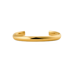 Daniel WellingtonのArch Cuff Gold 6mmは、ポリッシュ仕上げの滑らかなアーチ型カフブレスレットです。装飾を控えたミニマルなオープンカフデザインが特徴で、上品な印象に仕上がっています。