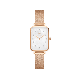 Daniel WellingtonのQuadro Lumine Pressed Piano White MoP Rose Goldは、ホワイトマザーオブパールの文字盤に12個のクリスタルインデックスをあしらったレクタンギュラーケースと、光を美しく反射するローズゴールドのプレス加工ピアノストラップが特徴の女性向け腕時計です。