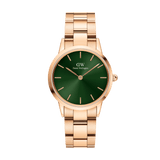 Daniel Wellington Iconic Link Emerald Green Rose Goldの正面画像。深みのあるエメラルドグリーンのサンレイダイヤルに、ローズゴールドのバーインデックスと針が映えます。サテンとポリッシュ仕上げを交互に施した3ピースリンクブレスレットが、一体感のあるシルエットを描いています。