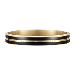 Daniel WellingtonのEmalie Infinite Gold Blackブレスレットです。ポリッシュ仕上げのゴールドとブラックエナメルのラインが交互に配され、中央のゴールドバンドにはブランドロゴが刻印されたシームレスなバングルデザインです。