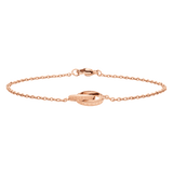 Elan Unity Bracelet ローズゴールドを正面から捉えた画像です。ケーブルチェーンが自然なアーチを描いて広がり、中央のDaniel Wellingtonロゴが刻まれたインターロッキングリングとロブスタークラスプの輝きが際立っています。