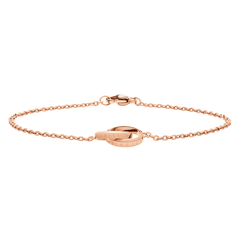 Elan Unity Bracelet ローズゴールドを正面から捉えた画像です。ケーブルチェーンが自然なアーチを描いて広がり、中央のDaniel Wellingtonロゴが刻まれたインターロッキングリングとロブスタークラスプの輝きが際立っています。