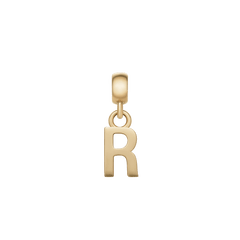 Daniel WellingtonのLetter Charm Goldは、アルファベットの「R」をモチーフにしたデザインです。直線と曲線が織りなすフォルムが印象的で、磨き上げられたゴールドの輝きが白い背景に映えます。